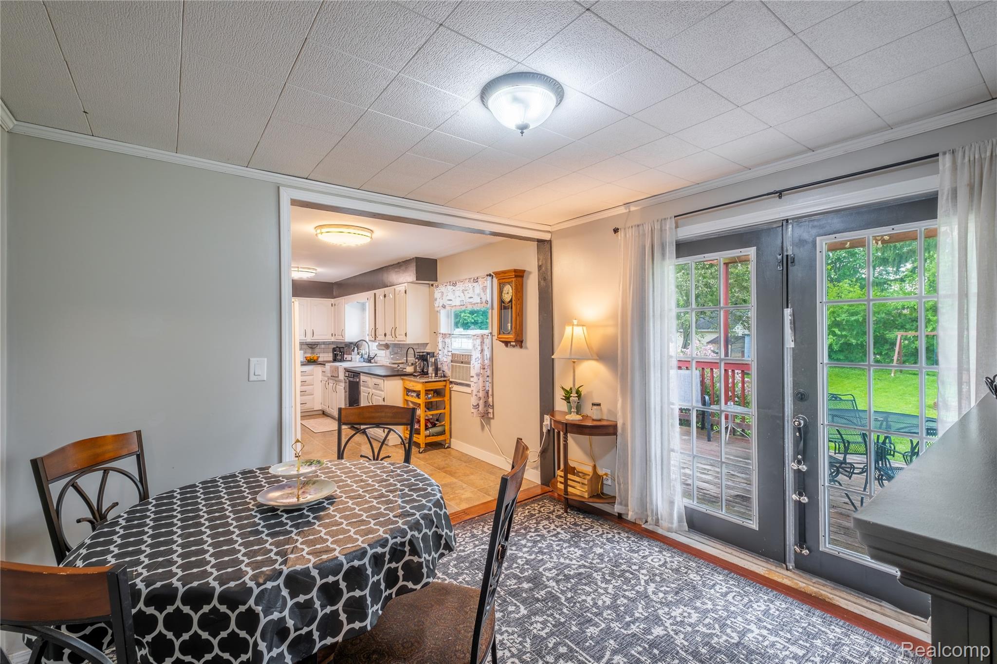 7800 Maple Street Birch Run, MI 48415 - Photo 6 of 29 Dining area featuring light gray walls, a textured ceiling, and a ceiling-mounted light fixture
