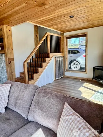 a view of a livingroom with furniture and window