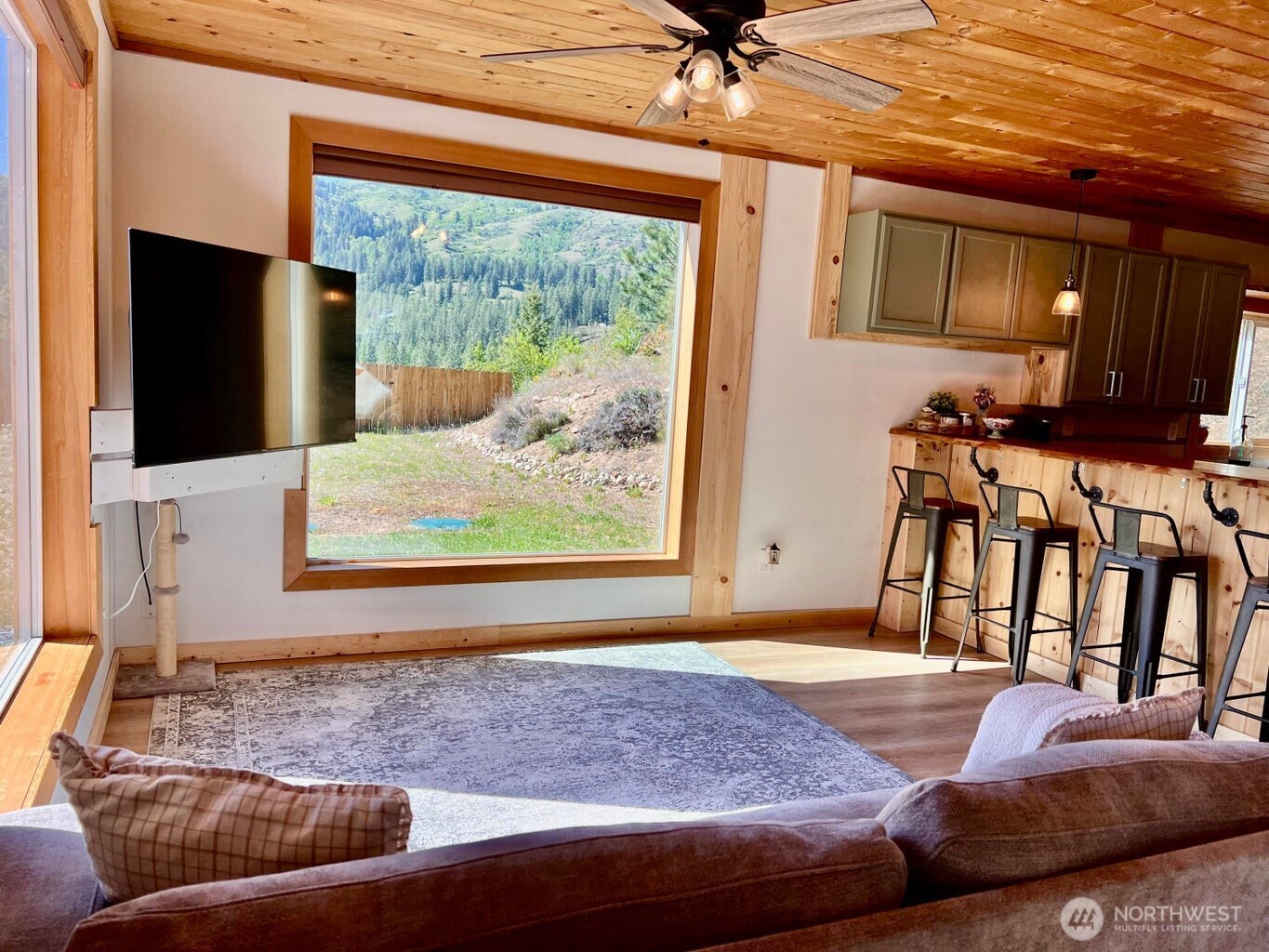 3705 Hope Way Kettle Falls, WA 99141 - Photo 19 of 37 a living room with furniture and a flat screen tv