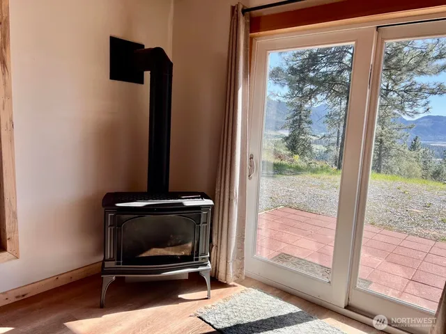a view of workspace with wooden floor and windows