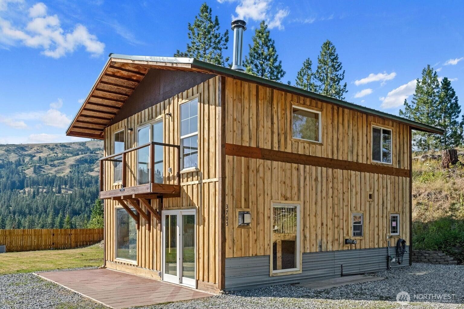 3705 Hope Way Kettle Falls, WA 99141 - Photo 2 of 37 a view of a house with a yard