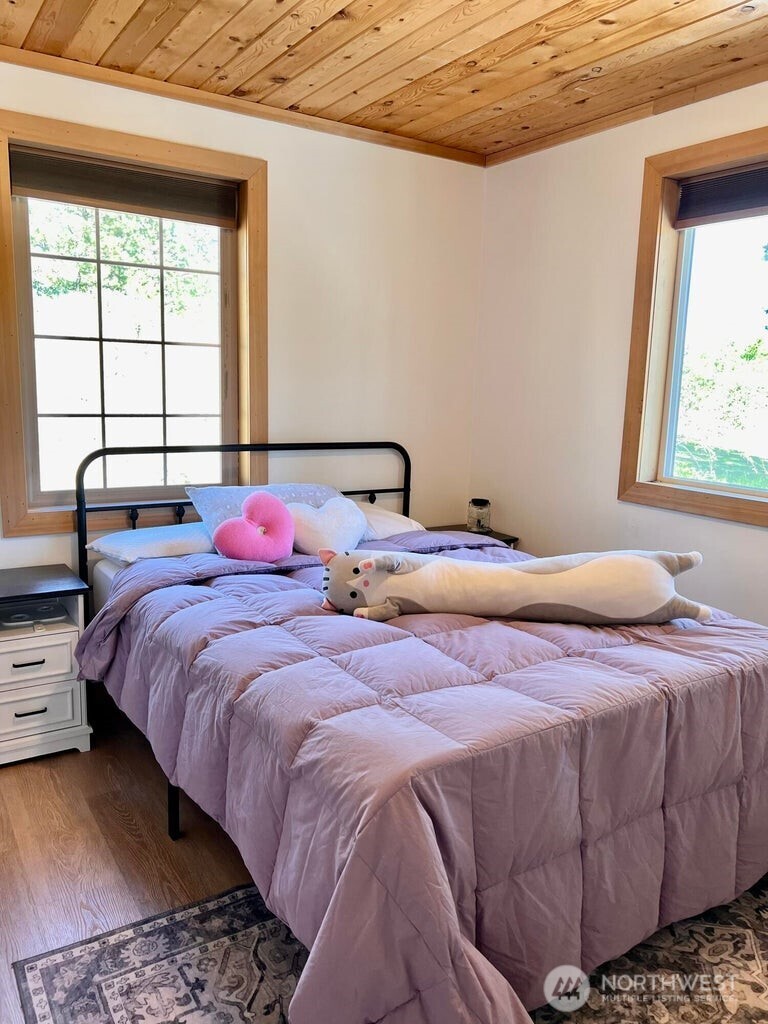 3705 Hope Way Kettle Falls, WA 99141 - Photo 26 of 37 a bedroom with a bed and a window