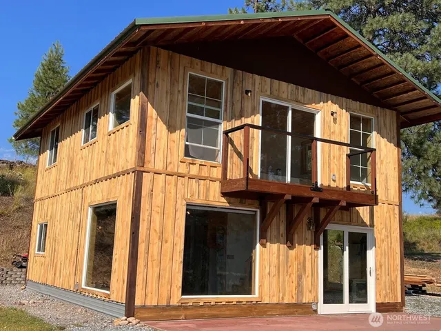 a view of a house with a door and a window