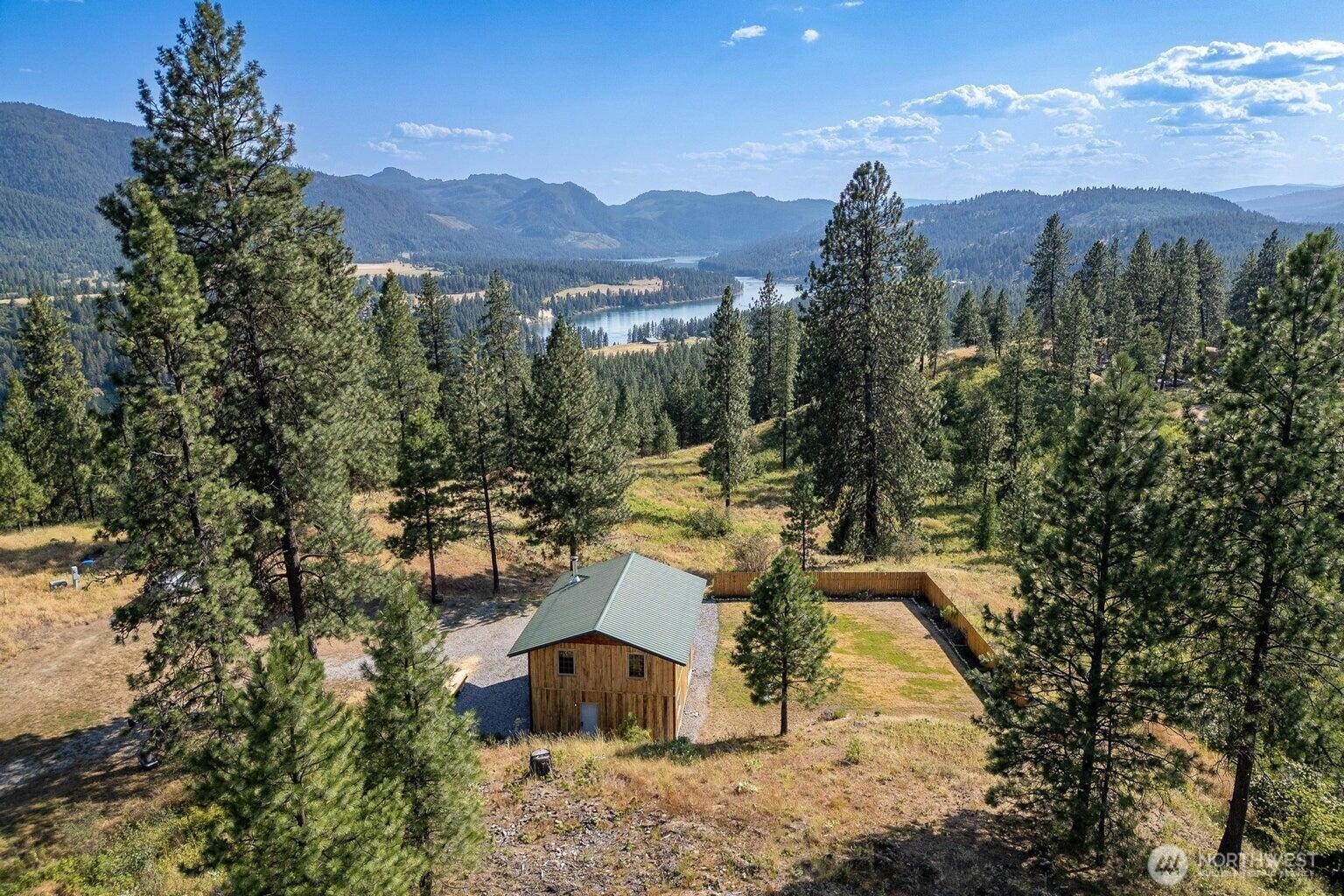 3705 Hope Way Kettle Falls, WA 99141 - Photo 5 of 37 a view of a town with mountains in the background