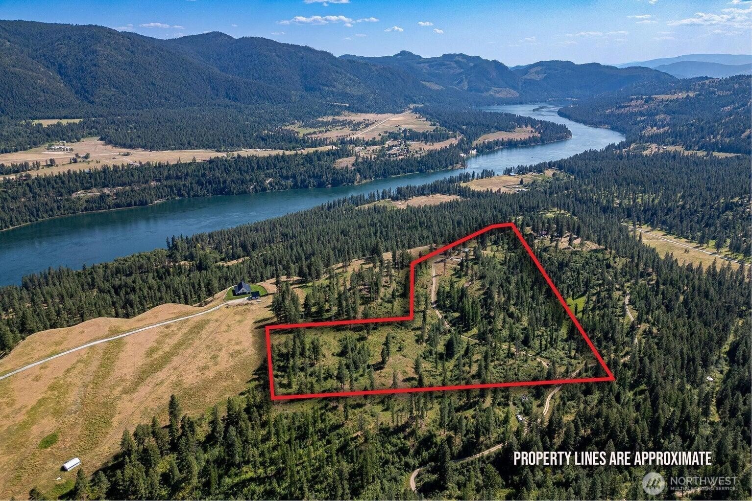 3705 Hope Way Kettle Falls, WA 99141 - Photo 6 of 37 a view of a lake with a mountain