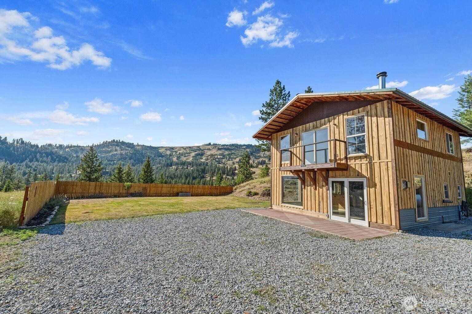 3705 Hope Way Kettle Falls, WA 99141 - Photo 8 of 37 a view of a house with a yard