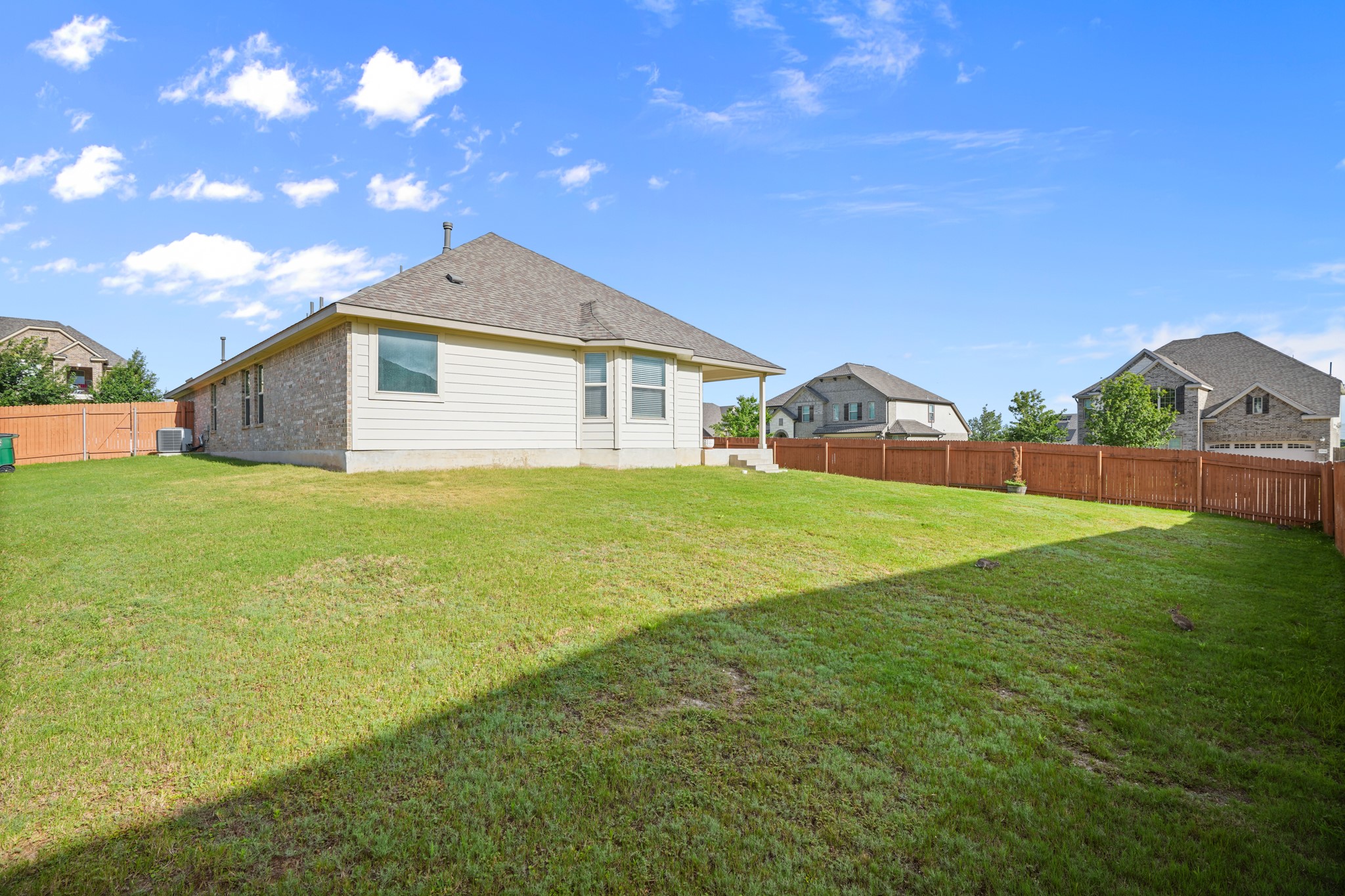 2209 Hat Bender Loop Round Rock, TX 78664 - Photo 24 of 25 a view of a house with a yard and garage