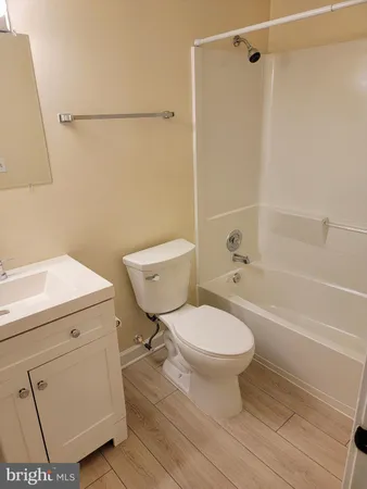 a bathroom with a toilet a sink and a shower