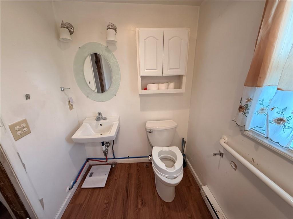 302 West Boyd Avenue Butler, PA 16001 - Photo 13 of 19 a bathroom with a toilet sink and mirror