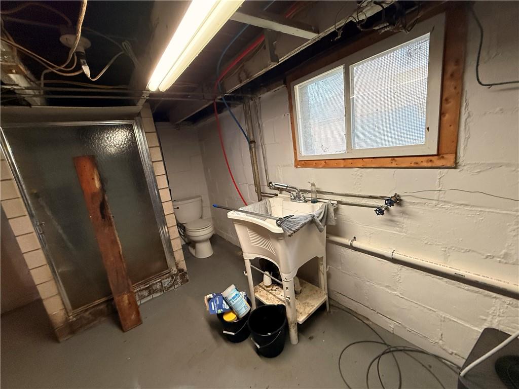 302 West Boyd Avenue Butler, PA 16001 - Photo 18 of 19 a bathroom with a sink mirror and toilet