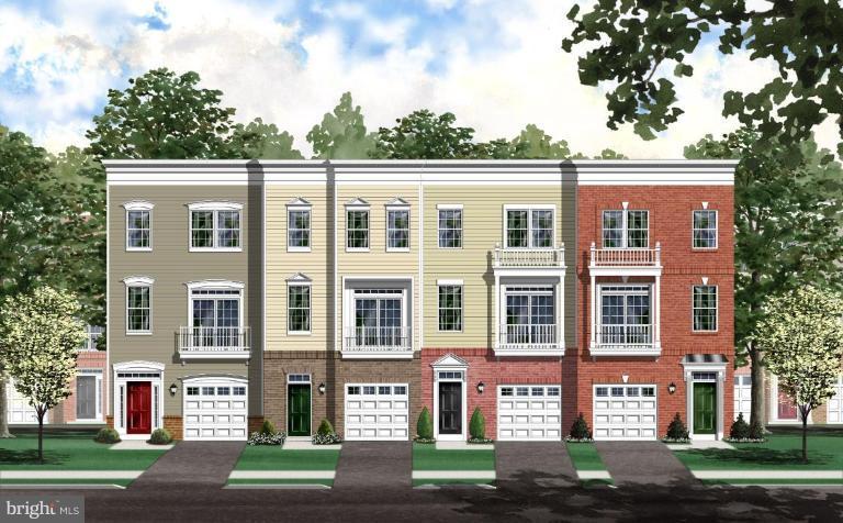 a front view of a residential apartment building with a yard