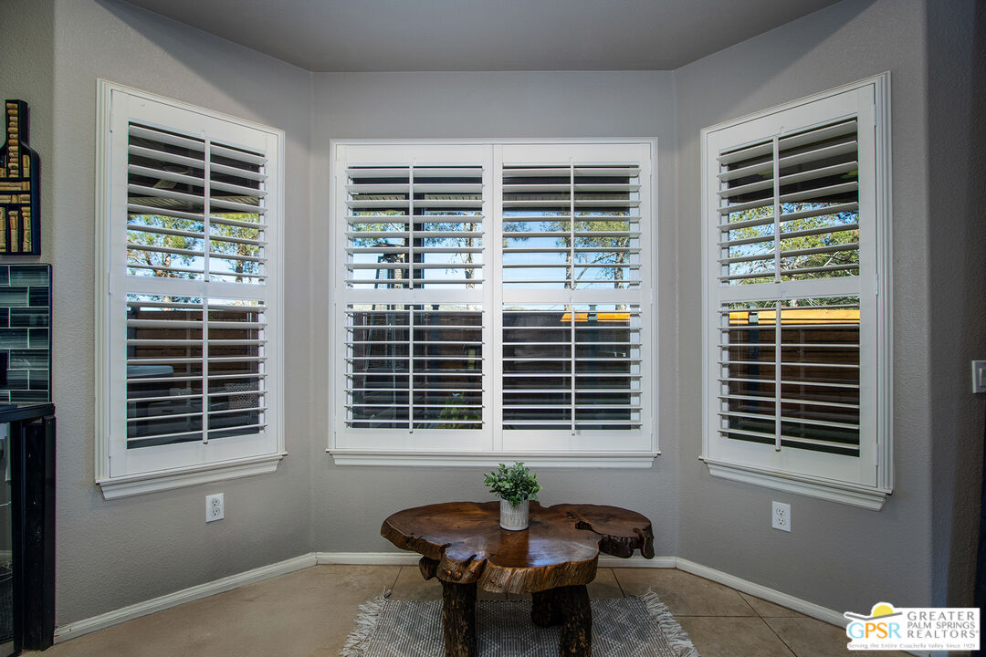 56166 Nez Perce Trail Yucca Valley, CA 92284 - Photo 13 of 54 a view of a room that has a couch and a table in it