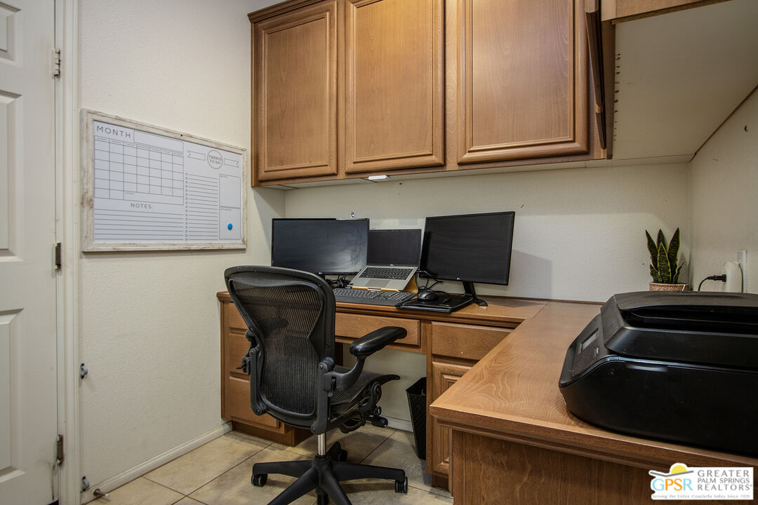 56166 Nez Perce Trail Yucca Valley, CA 92284 - Photo 20 of 54 a view of a workspace with furniture and a window