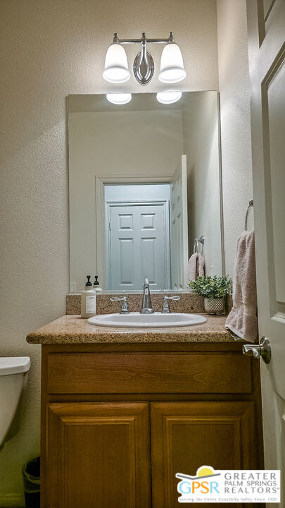 56166 Nez Perce Trail Yucca Valley, CA 92284 - Photo 21 of 54 a bathroom with a sink and a mirror