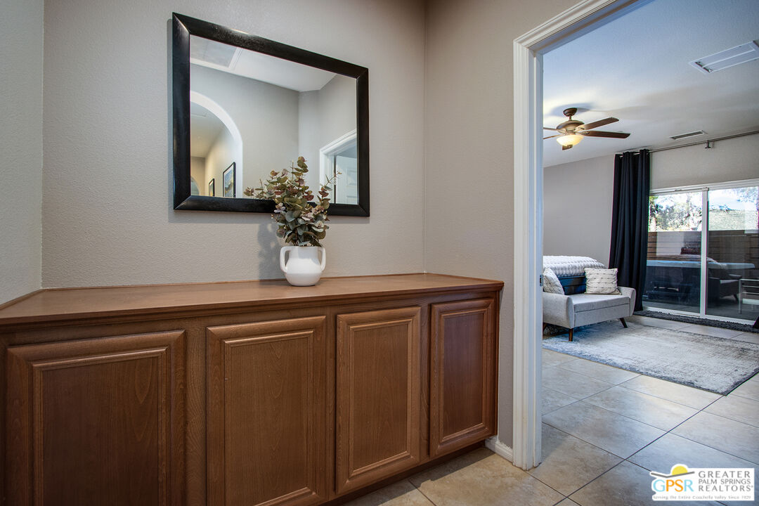 56166 Nez Perce Trail Yucca Valley, CA 92284 - Photo 22 of 54 a en suite bathroom with a granite countertop sink and a mirror