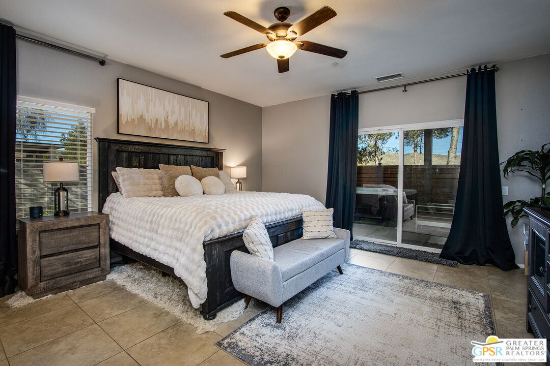 56166 Nez Perce Trail Yucca Valley, CA 92284 - Photo 23 of 54 a bedroom with a bed and a couch