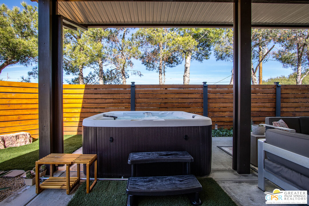 56166 Nez Perce Trail Yucca Valley, CA 92284 - Photo 40 of 54 a room with furniture and a floor to ceiling window