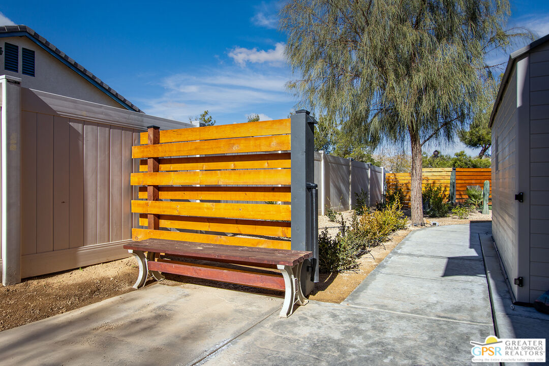 56166 Nez Perce Trail Yucca Valley, CA 92284 - Photo 45 of 54 a view of backyard with tub and trees in the background