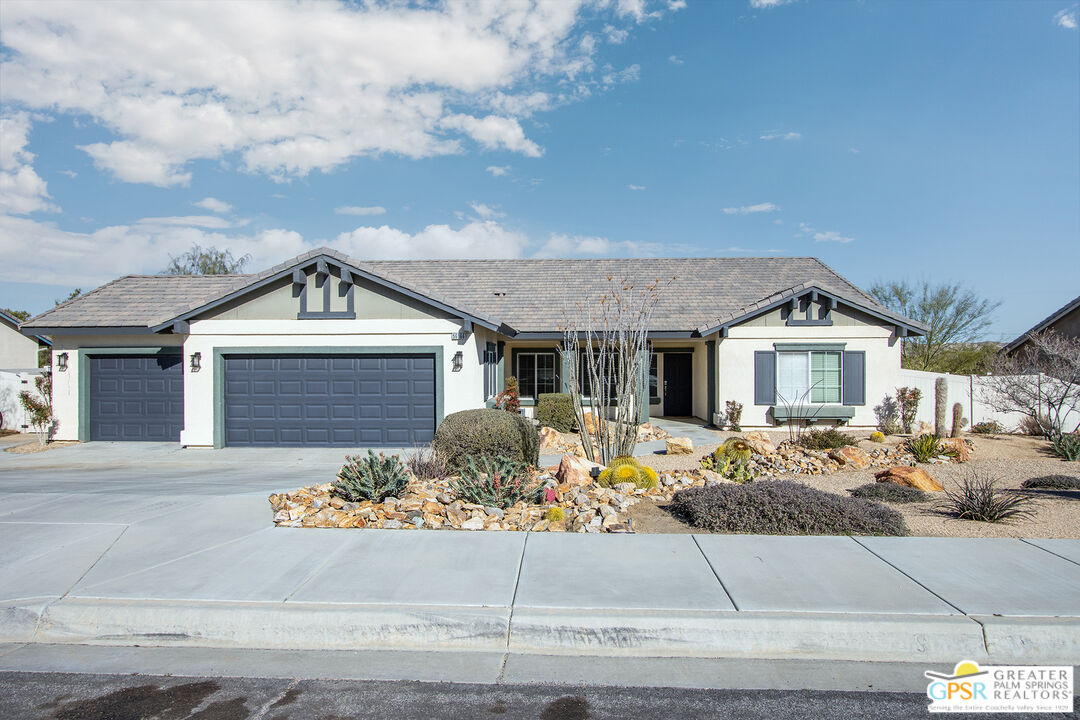 56166 Nez Perce Trail Yucca Valley, CA 92284 - Photo 50 of 54 a front view of a house with garage