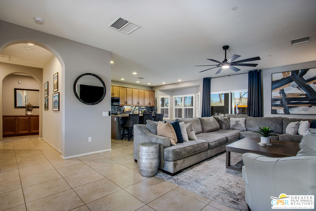 56166 Nez Perce Trail Yucca Valley, CA 92284 - Photo 7 of 54 a living room with furniture and kitchen view