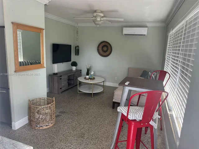 a kitchen with a sink cabinets and window