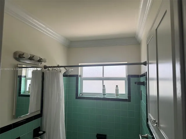 a bedroom with a bed and a cabinets