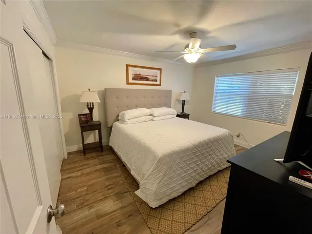 a bedroom with a bed and a desk
