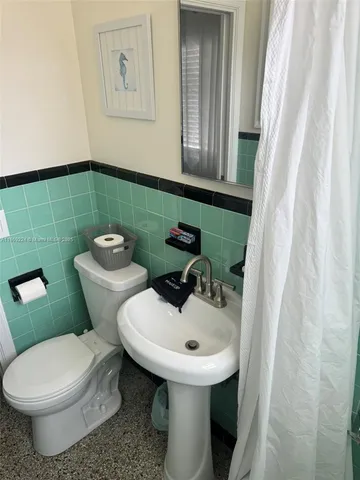 a view of a livingroom with furniture and a window