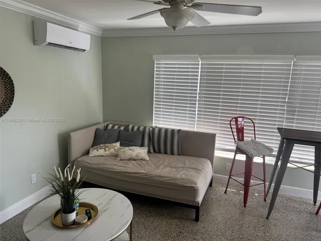 a living room with furniture and a window