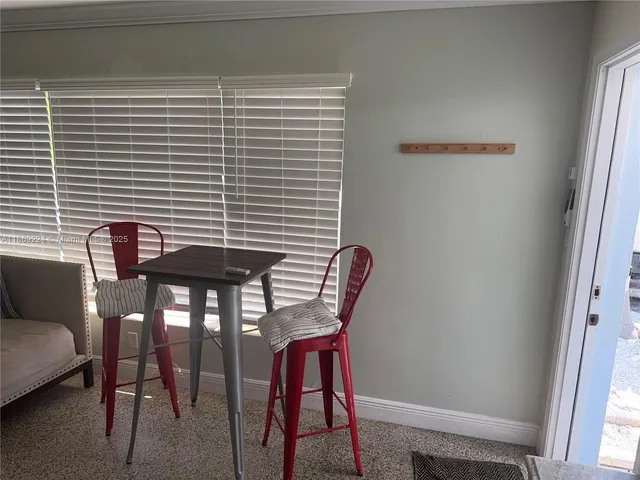 a view of backyard of house with green space