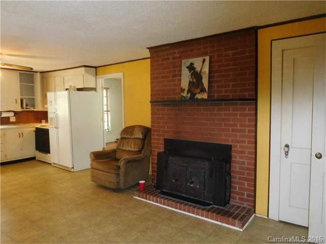 1980 Troutman Hill Road Kannapolis, NC 28083 - Photo 4 of 12 a living room with furniture and a fireplace