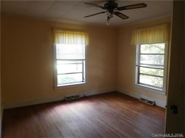 1980 Troutman Hill Road Kannapolis, NC 28083 - Photo 7 of 12 a view of an empty room with wooden floor and a window