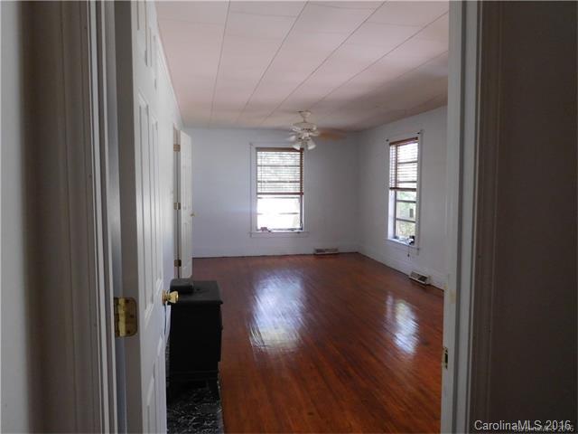 1980 Troutman Hill Road Kannapolis, NC 28083 - Photo 10 of 12 a view of an empty room with wooden floor and a window