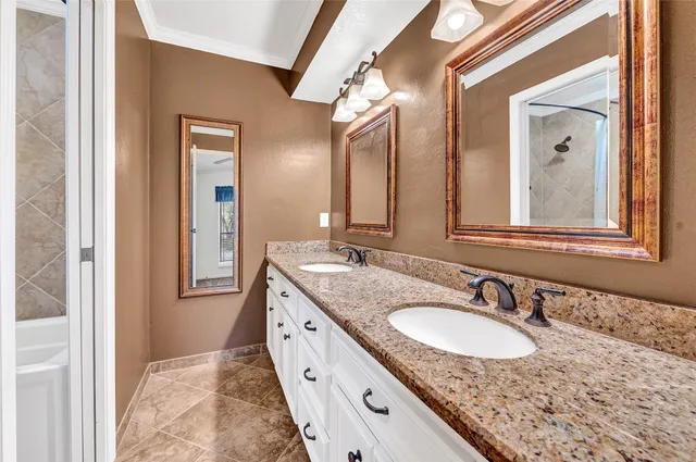 a white toilet sitting next to a bath tub and shower