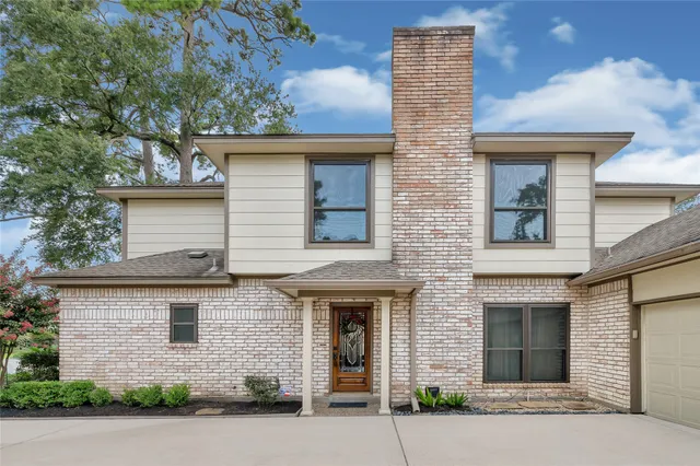 front view of brick house with a street