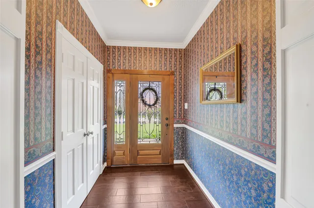 a view of an entryway with wooden floor