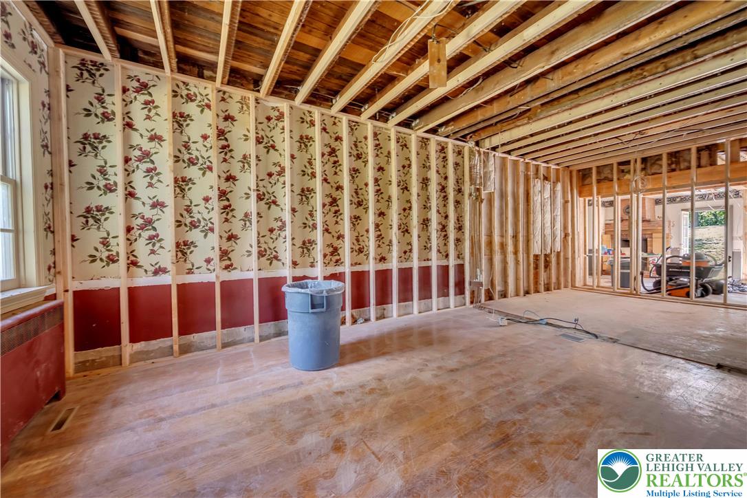 384 Henry Road Nazareth, PA 18064 - Photo 30 of 54 Exposed ceiling joists and stud walls highlight this interior space undergoing renovation.