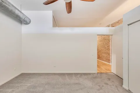 a view of a bathroom with sink and shower