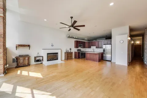 a view of kitchen with cabinets and wooden floor