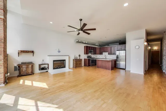 a view of kitchen with cabinets and wooden floor