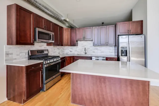 a kitchen with a stove and a microwave