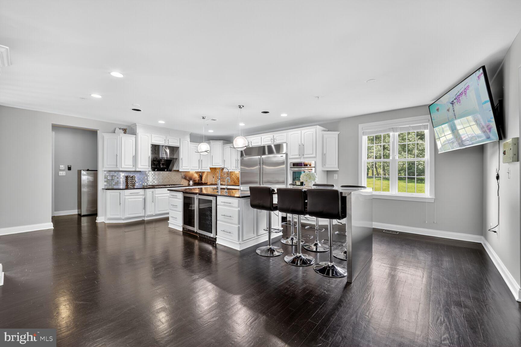 16831 Swanson Road Upper Marlboro, MD 20774 - Photo 12 of 56 a open kitchen with white cabinets and stainless steel appliances