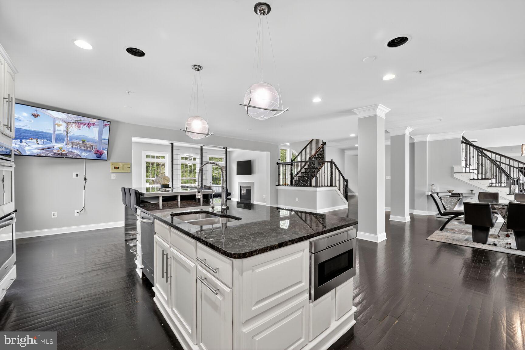 16831 Swanson Road Upper Marlboro, MD 20774 - Photo 14 of 56 a kitchen with stainless steel appliances granite countertop a stove and a wooden floors