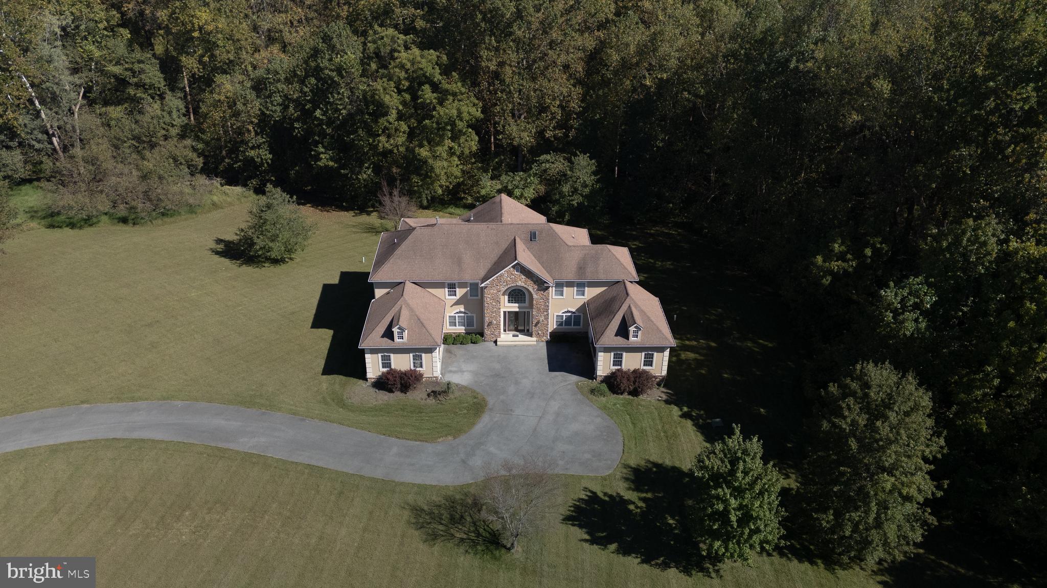 16831 Swanson Road Upper Marlboro, MD 20774 - Photo 2 of 56 an aerial view of a house with outdoor space pool seating area and lake view