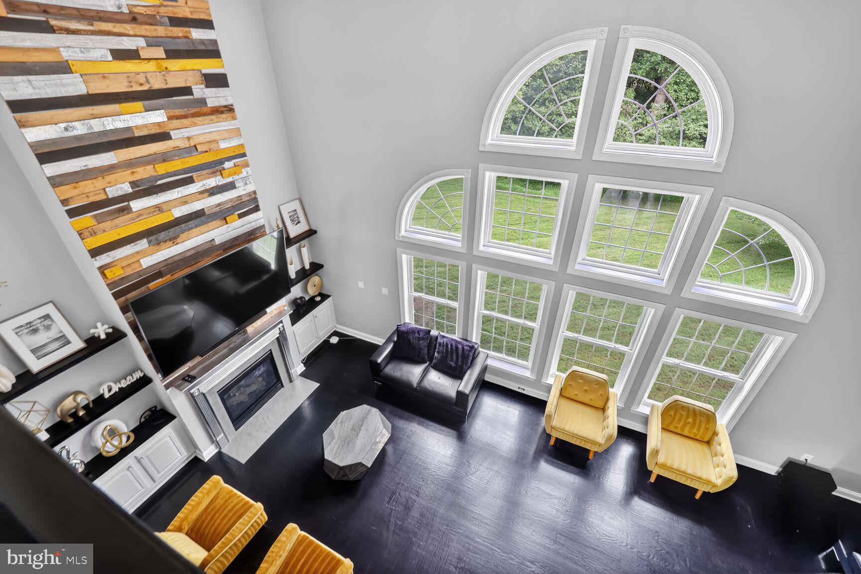 16831 Swanson Road Upper Marlboro, MD 20774 - Photo 22 of 56 a living room with furniture and a floor to ceiling window