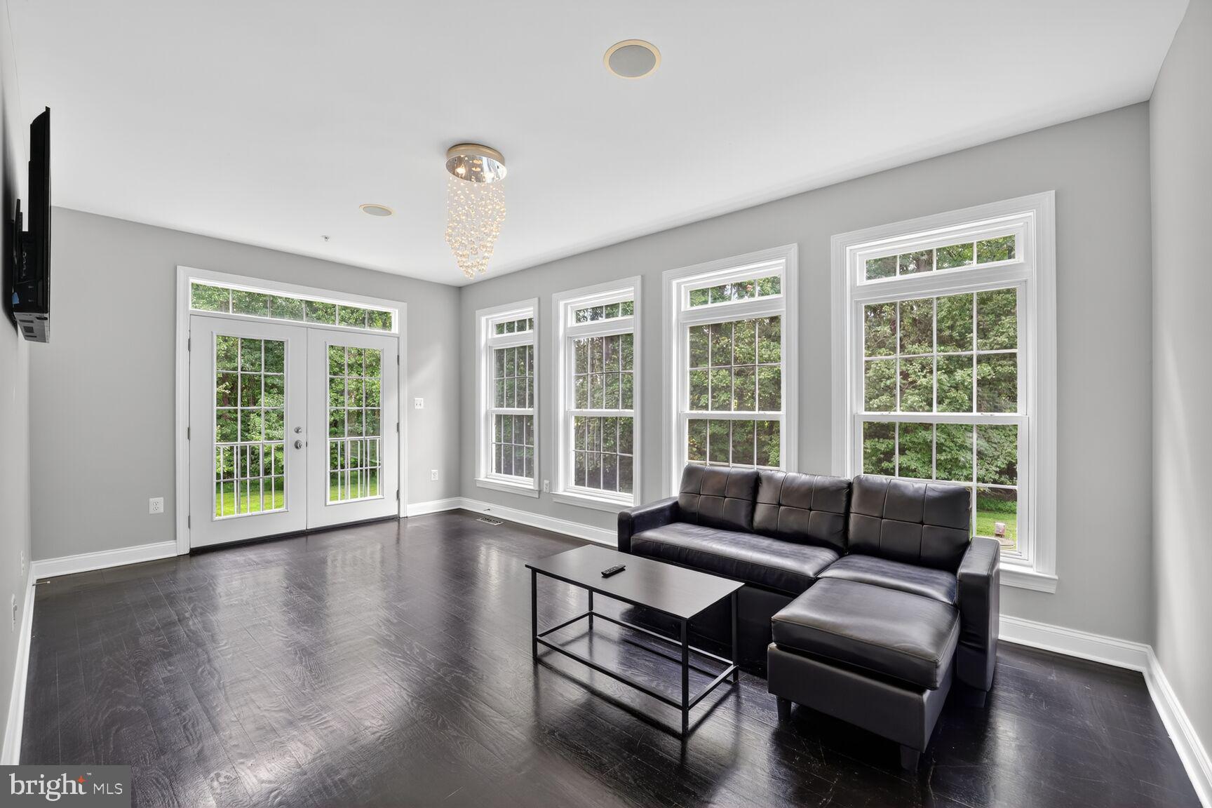 16831 Swanson Road Upper Marlboro, MD 20774 - Photo 25 of 56 a living room with furniture and a large window