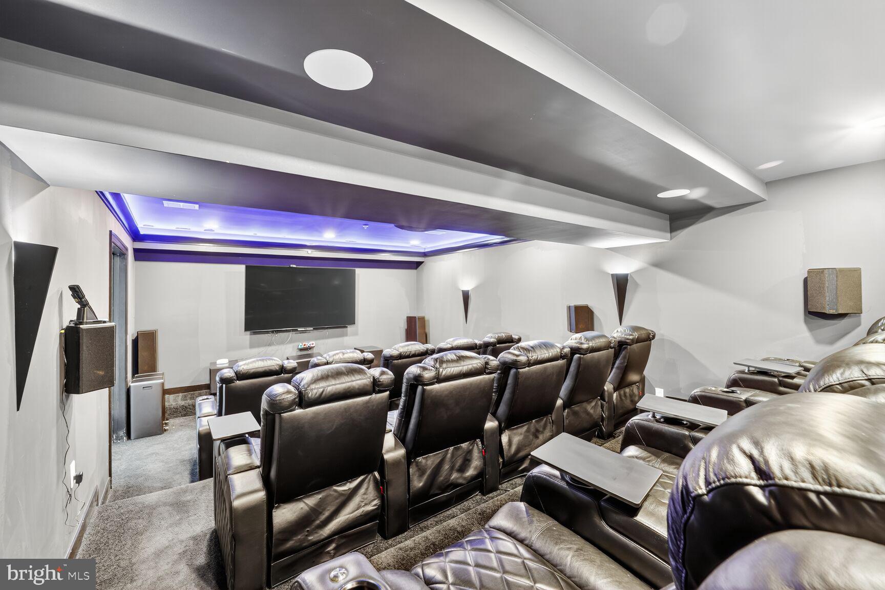 16831 Swanson Road Upper Marlboro, MD 20774 - Photo 52 of 56 a media room with lots of chairs and a projector screen