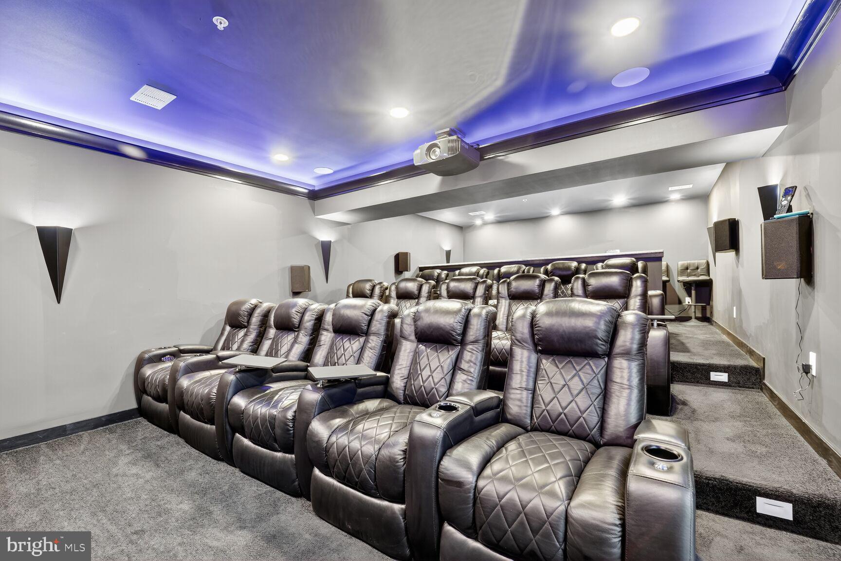 16831 Swanson Road Upper Marlboro, MD 20774 - Photo 53 of 56 a media room with lots of chairs and a projector screen