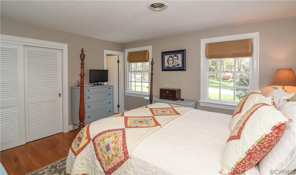 2711 Salisbury Road Midlothian, VA 23113 - Photo 22 of 47 a bed sitting in a bedroom next to a window with a flat tv screen and a dresser