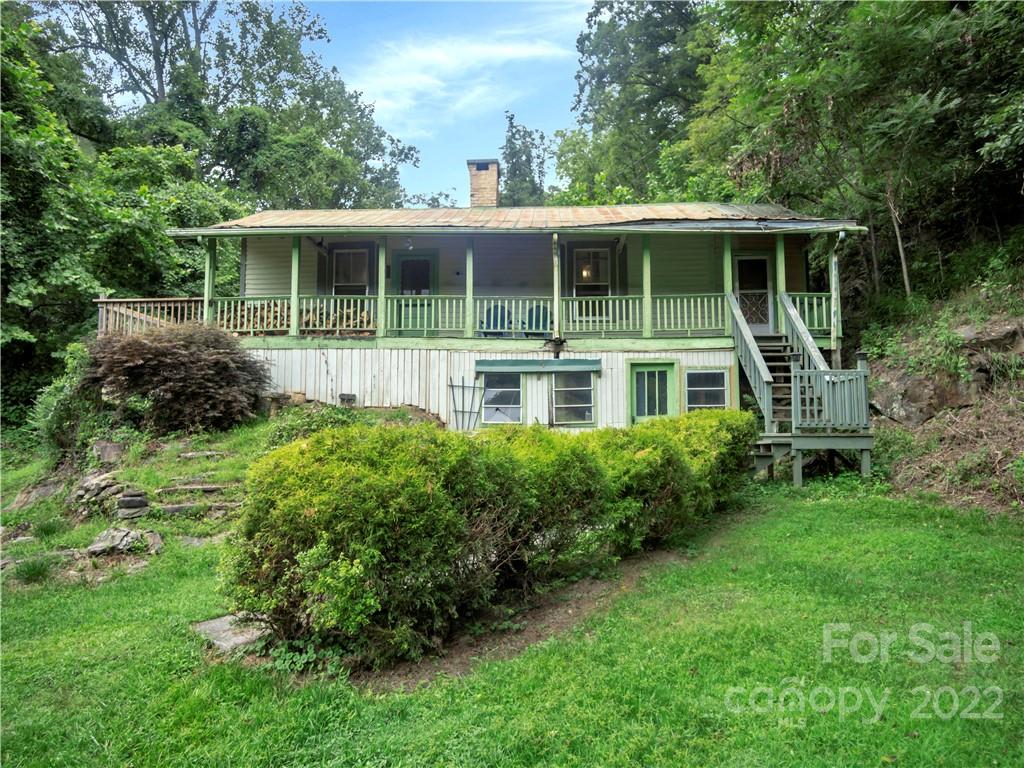 2731 Redmon Road Marshall, NC 28753 - Photo 1 of 43 a house view with a garden space